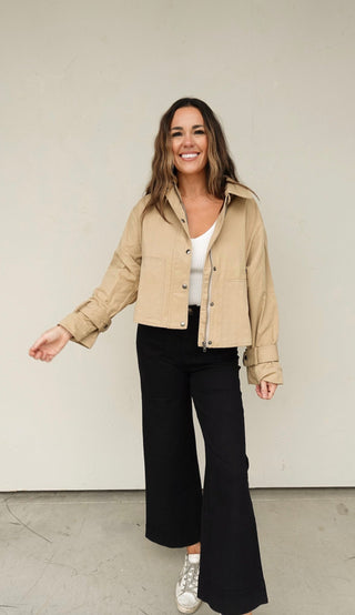 Woman in jacket linking to outerwear collection